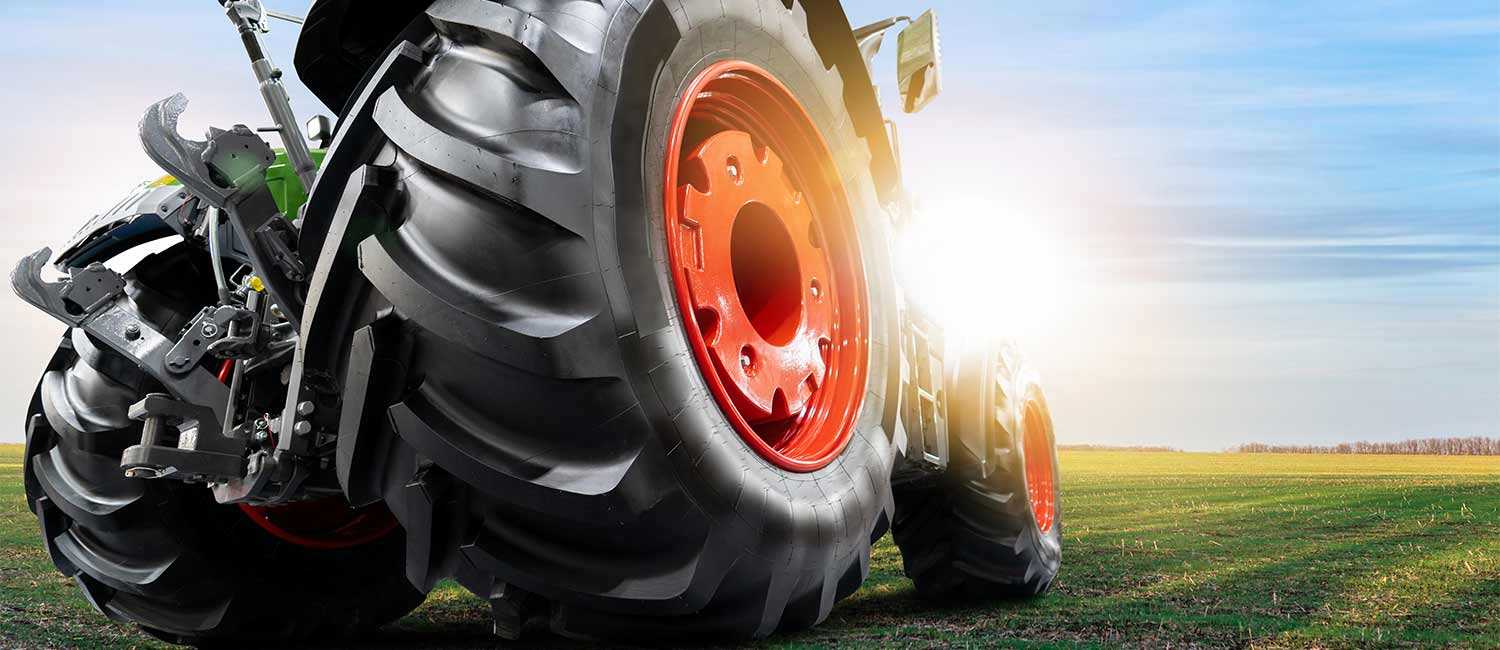 Farm Equipment On a Green Field